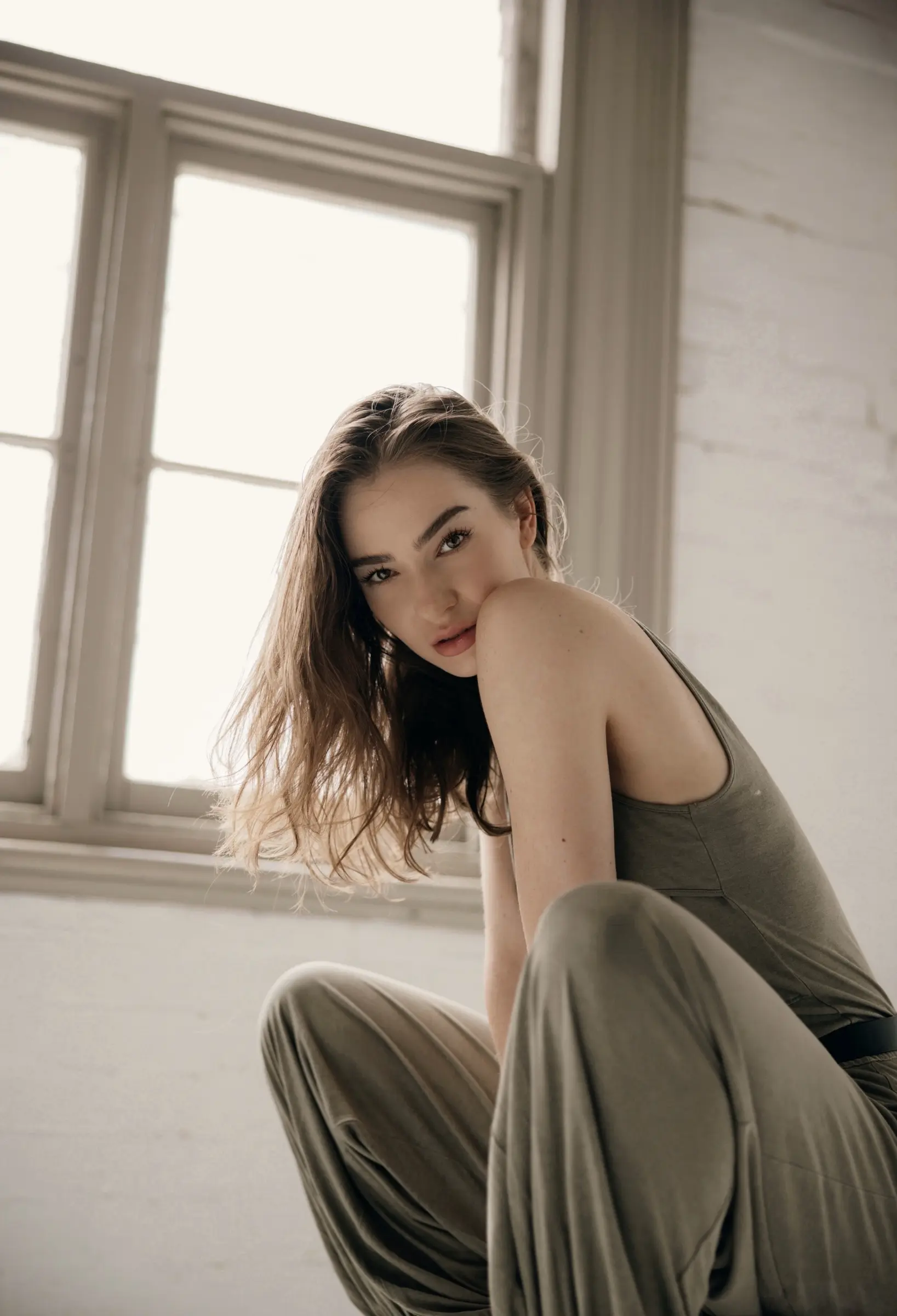 Martyna Jablonski sitting by a window